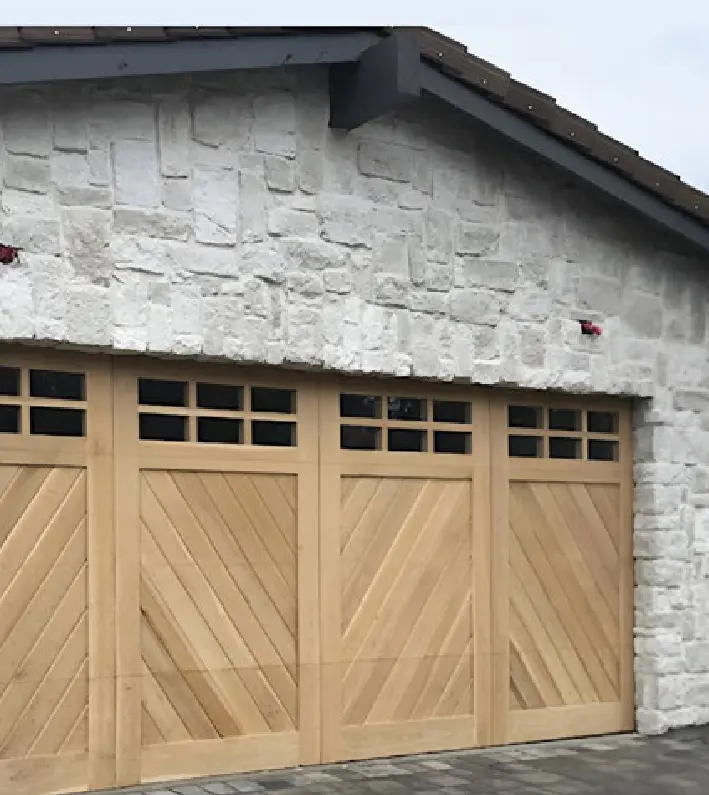 A garage door that is made of wood.