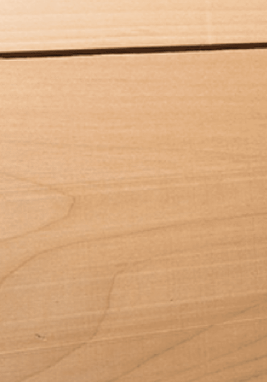 A close up of the wood grain on a table.